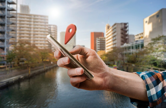 Person using phone outdoors