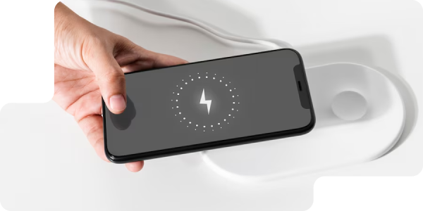Hand holding a smartphone with power icon