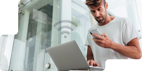 Person using laptop and phone
